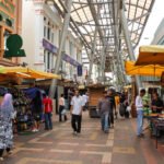 Kuala Lumpur, Malaysia- October 2012: A crowded shopping street with street vendors in a mall in the city of Kuala Lumpur.