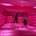 Visitors jump in a bouncy castle at the Museum of Ice Cream in Singapore, August 19, 2021. REUTERS/Travis Teo